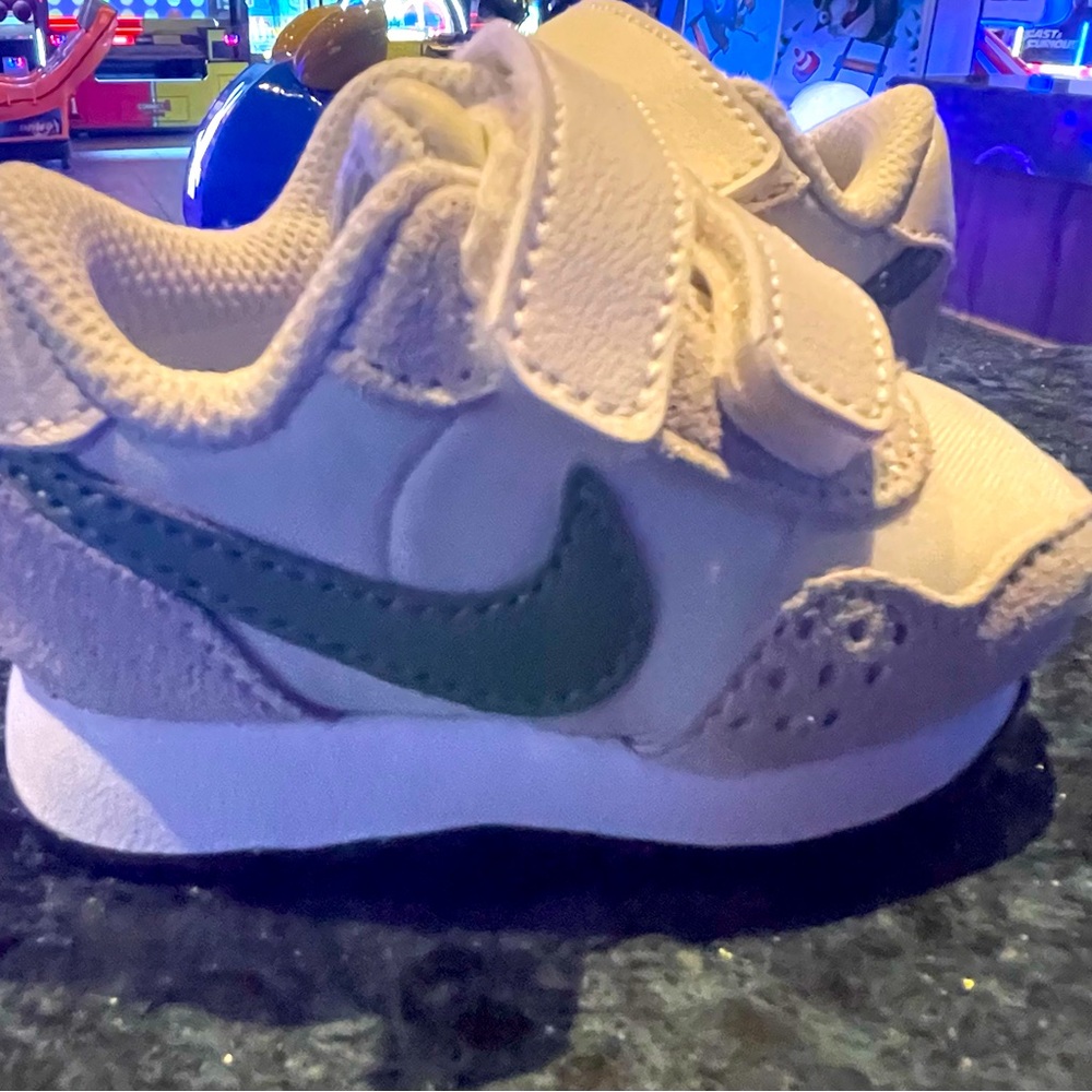 Babies 2c Nikes me valiant tan and green